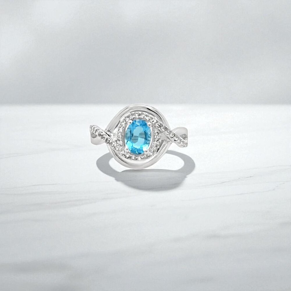 Silver Ring with Bright Blue Gemstone and Halo Accents